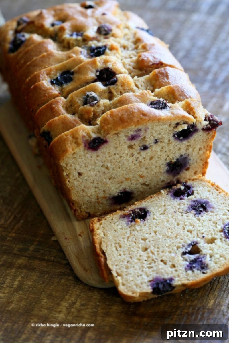 Close-up of a freshly baked Vegan Lemon Blueberry Cake batter with blueberries folded in, ready for the oven.