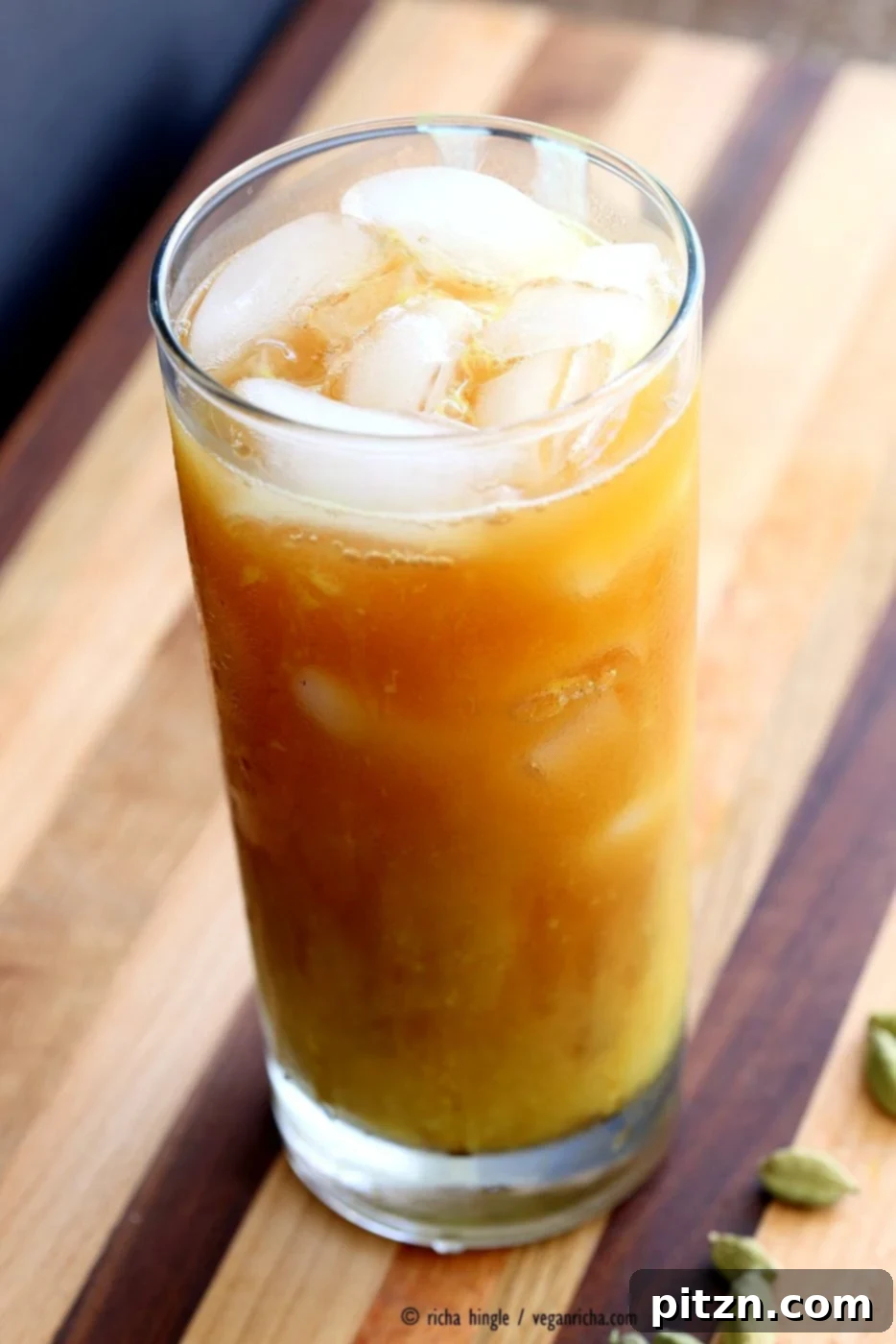 Cardamom Cinnamon Turmeric Iced Tea. Spiced Iced tea like Thai Iced tea with turmeric coconut milk and Indian masala chai spices and ginger. Golden Milk Iced Tea. Vegan Gluten-free Soy-free Recipe | VeganRicha.com