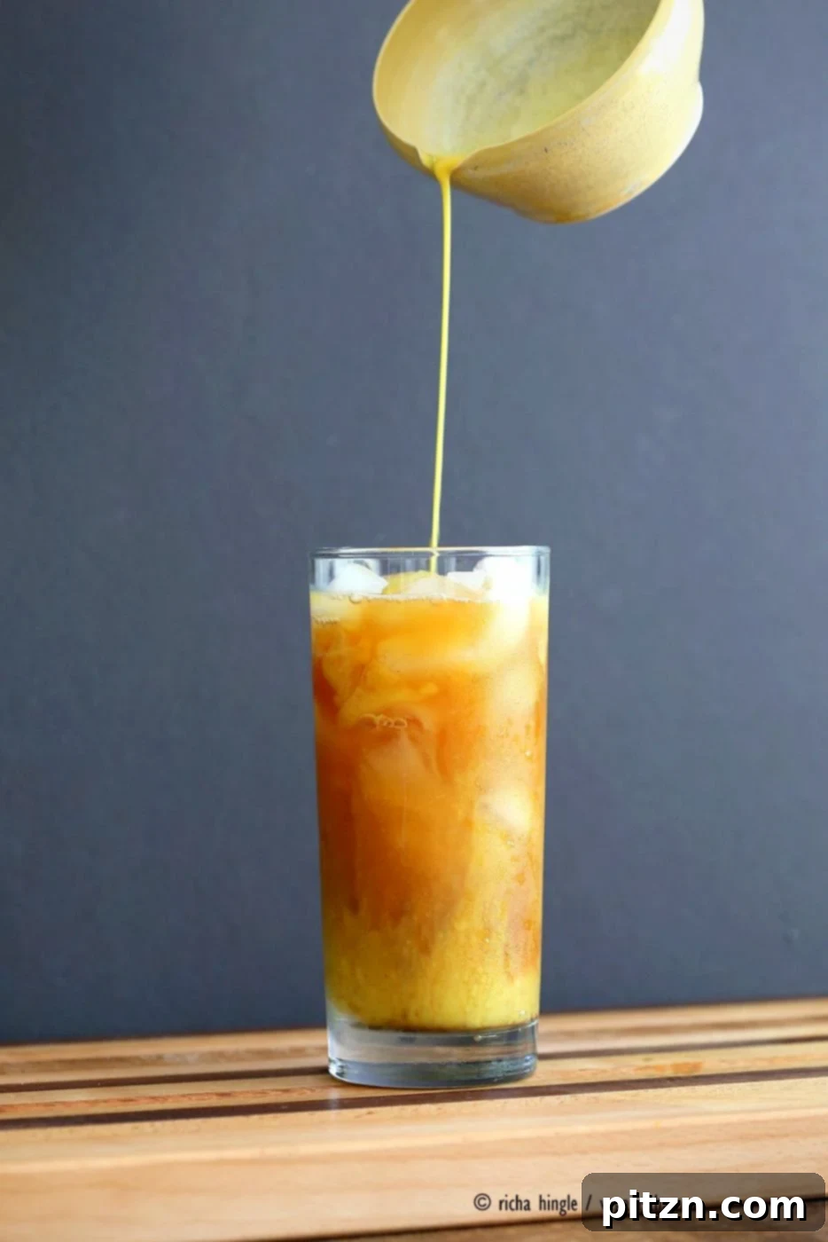 Cardamom Cinnamon Turmeric Iced Tea. Spiced Iced tea like Thai Iced tea with turmeric coconut milk and Indian masala chai spices and ginger. Golden Milk Iced Tea. Vegan Gluten-free Soy-free Recipe | VeganRicha.com