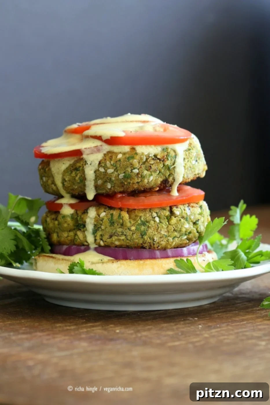 Flavorful Vegan Falafel Burgers Made Easy 3 Easy Vegan Falafel Burger. Chickpea patties with a generous helping of tahini dressing, tomatoes, onions, and pickles for a satisfying meal. Vegan Soy-free Recipe.