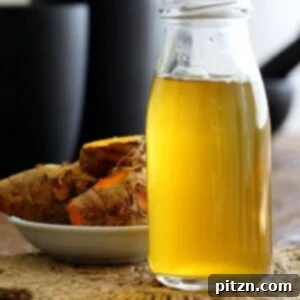 Golden Ginger Wellness Brew 5 Ginger Turmeric Root Tea. Fresh Turmeric Root and ginger simmered with black pepper. Add sweetener of choice. Serve hot or chilled. Vegan Gluten-free Recipe | VeganRicha.com #glutenfree #veganricha #vegan