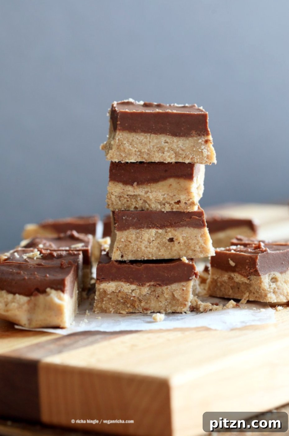Decadent Chocolate Almond Butter Fudge Bars 7 Stacked Chocolate Almond Butter Fudge Bars, showcasing the beautiful two-layer texture. This easy vegan recipe is no-bake, gluten-free, and soy-free, making it a perfect healthy dessert or snack option.