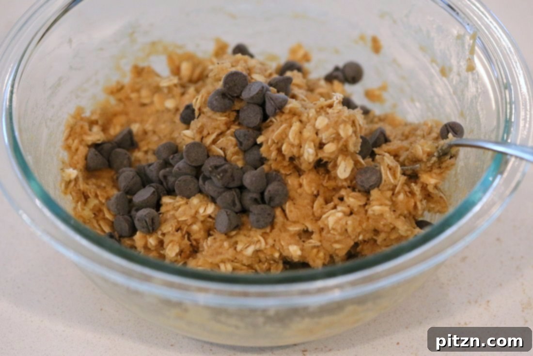 Fold in chocolate chips or currants, cranberries.