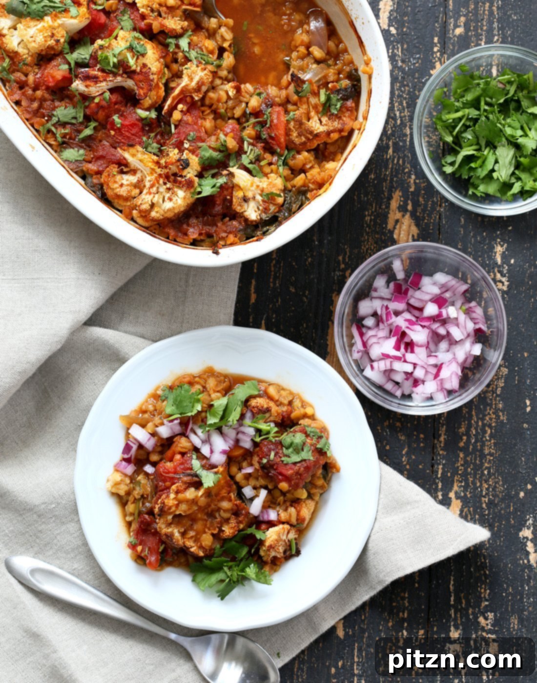 Smoky BBQ Lentil Farro Cauliflower Bake 10 A vibrant and appetizing shot of the BBQ Lentil Farro Cauliflower Casserole, served hot.