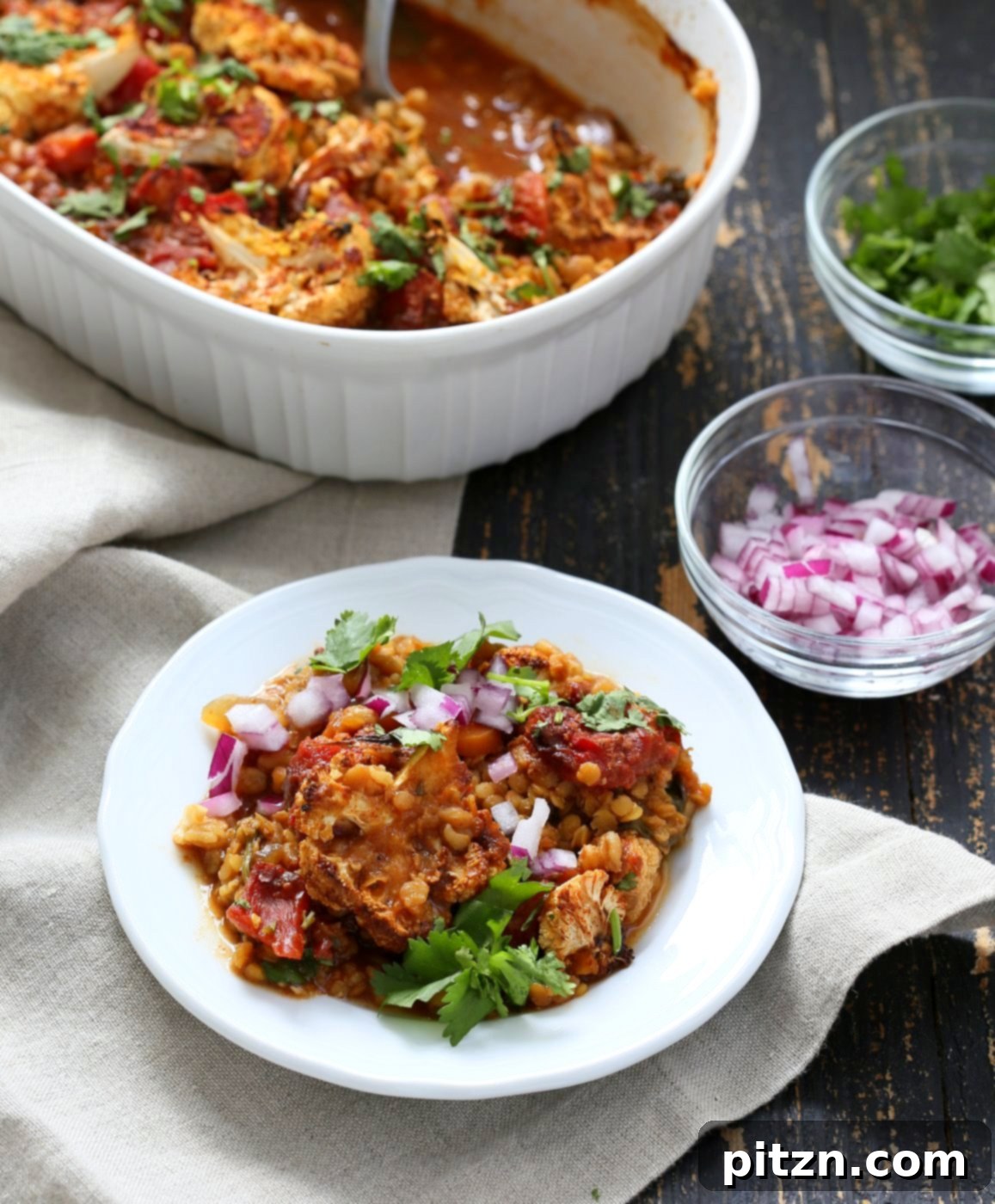 Smoky BBQ Lentil Farro Cauliflower Bake 3 Close-up of the BBQ Lentil Farro Cauliflower Casserole, showcasing its rich textures and inviting colors. A perfect vegan and gluten-free comfort food option.