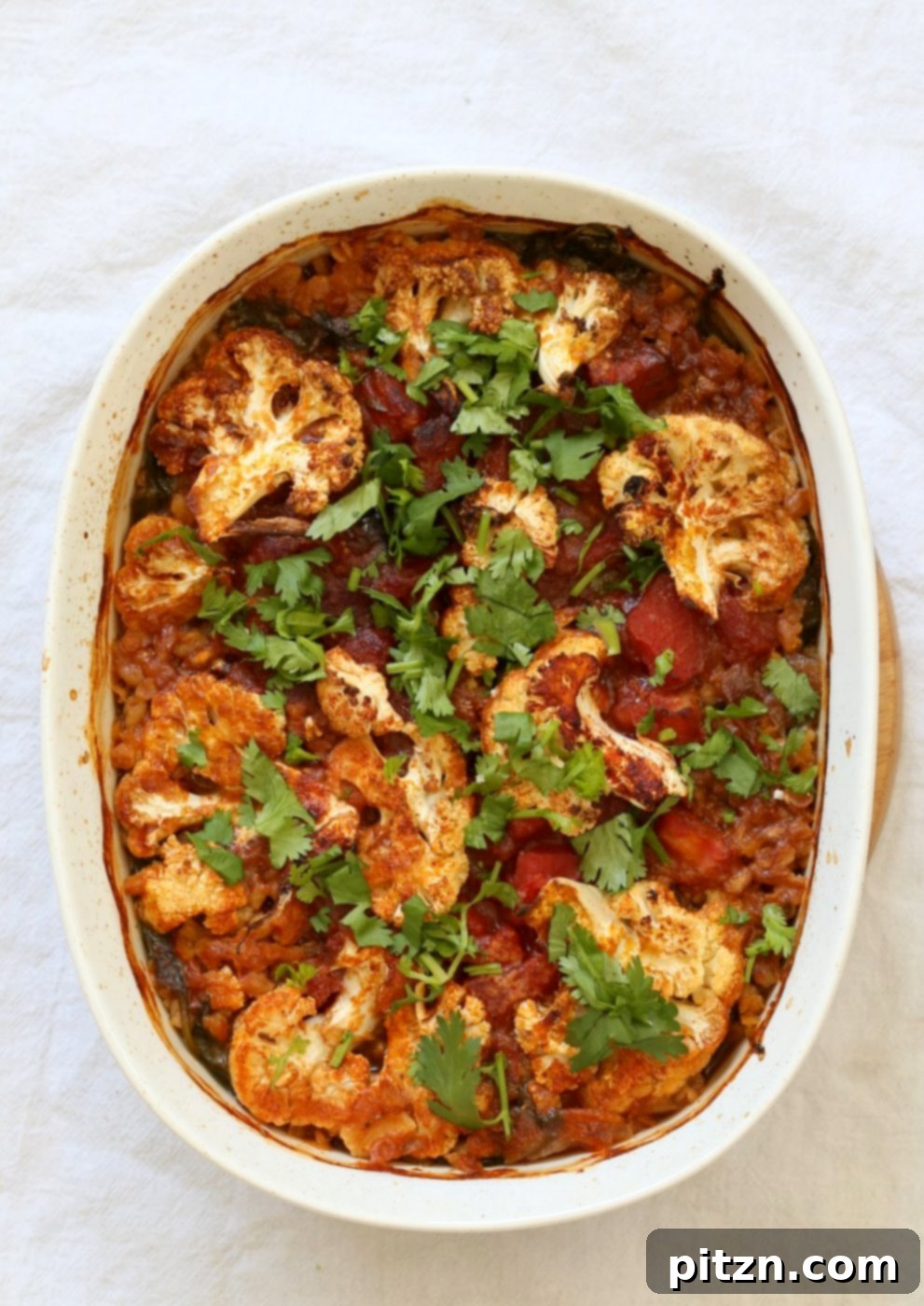 Smoky BBQ Lentil Farro Cauliflower Bake 8 A tantalizing view of the BBQ Lentil Farro Cauliflower Casserole, showcasing its incredible textures and flavors.