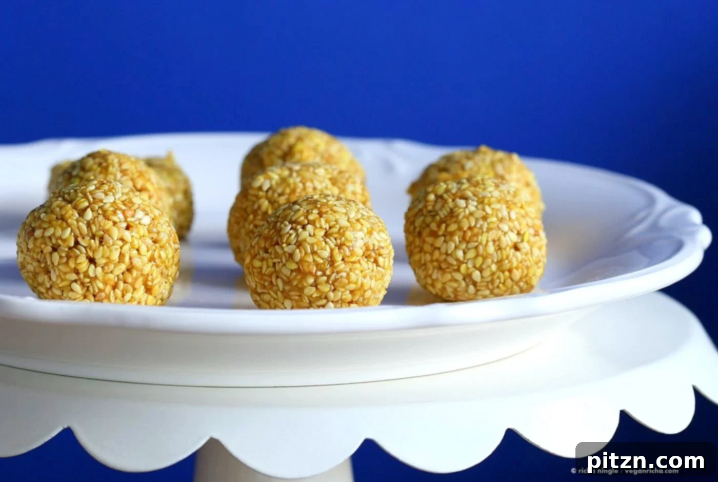 Crispy Golden Sesame Balls 4 Golden Turmeric Sesame Balls, perfectly rolled and ready for a healthy snack. Vegan, gluten-free, nut-free energy bites with cinnamon and cardamom.