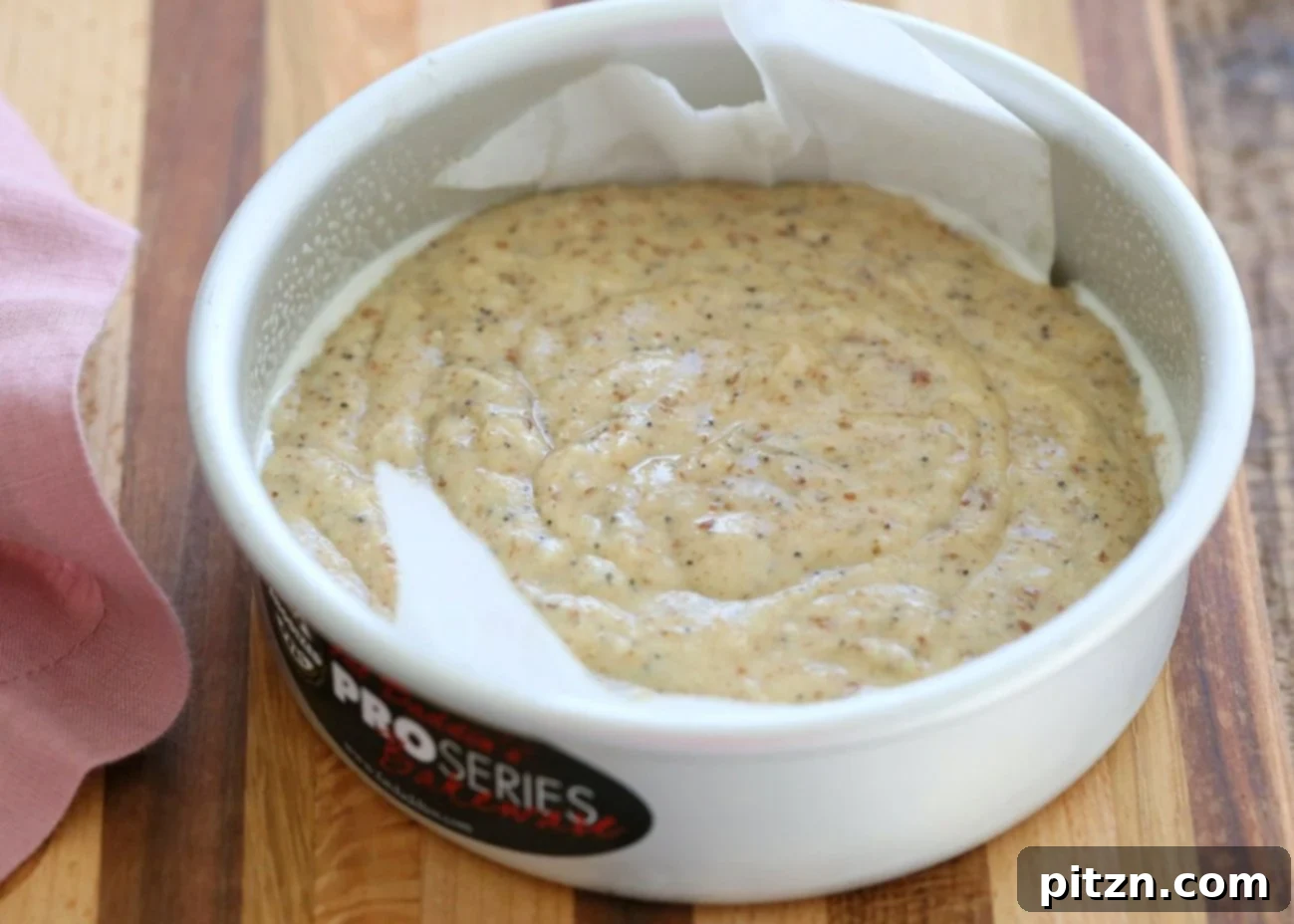 Vegan Gluten-Free Almond Poppy Seed Cake 4 Mixing wet and dry ingredients for the Vegan Almond Poppy Seed Cake batter.