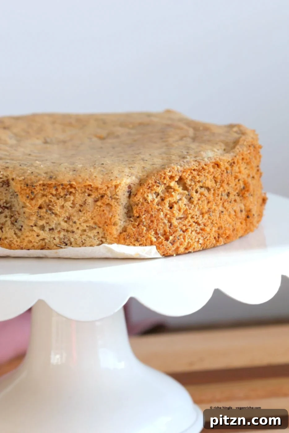 Vegan Gluten-Free Almond Poppy Seed Cake 5 Baked Vegan Almond Poppy Seed Cake being tested with a toothpick.
