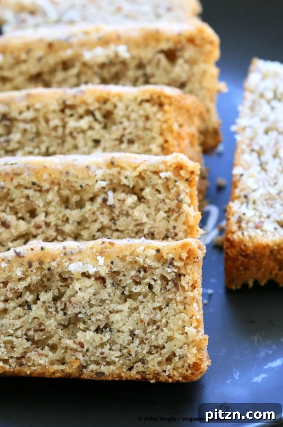 Vegan Gluten-Free Almond Poppy Seed Cake 8 Beautifully sliced Vegan Almond Poppy Seed Cake, ready to be served.