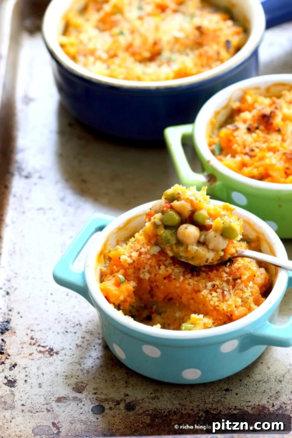 Hearty Vegan Chickpea and Sweet Potato Shepherd's Pie 2 Close-up of the golden, herb-crusted sweet potato topping on Vegan Shepherd's Pie, showcasing its inviting texture and vibrant ingredients.