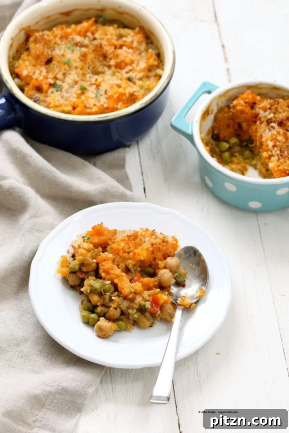 Hearty Vegan Chickpea and Sweet Potato Shepherd's Pie 6 Delicious Vegan Shepherd's Pie with Chickpeas and Sweet Potato, served in an individual ramekin, showing the perfect golden crust and hearty filling.