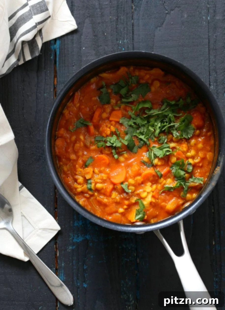 Chana Dal Veggie Carrot Soup. Easy Split Pea Soup with turmeric, spices, carrots, cauliflower, butternut squash. 1 Pot ready within 45 minutes. Use split chickpeas (Chana Dal) or other split peas or lentils. Vegan Gluten-free Soy-free Recipe | VeganRicha.com