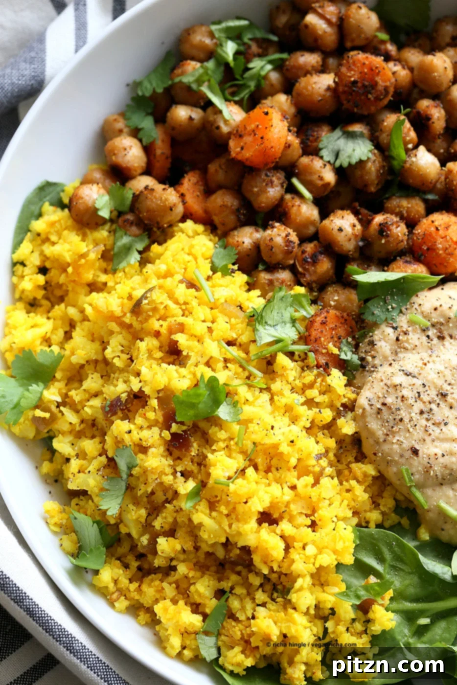Spiced Golden Buddha Bowl with Pepper Hummus 3 Turmeric Cauliflower Rice, Spiced Chickpeas or lentils, Black pepper hummus and Greens bowl. Amazing Flavors for any meal. Ready within 25 minutes. Vegan Gluten-free Soy-free Recipe | VeganRicha.com