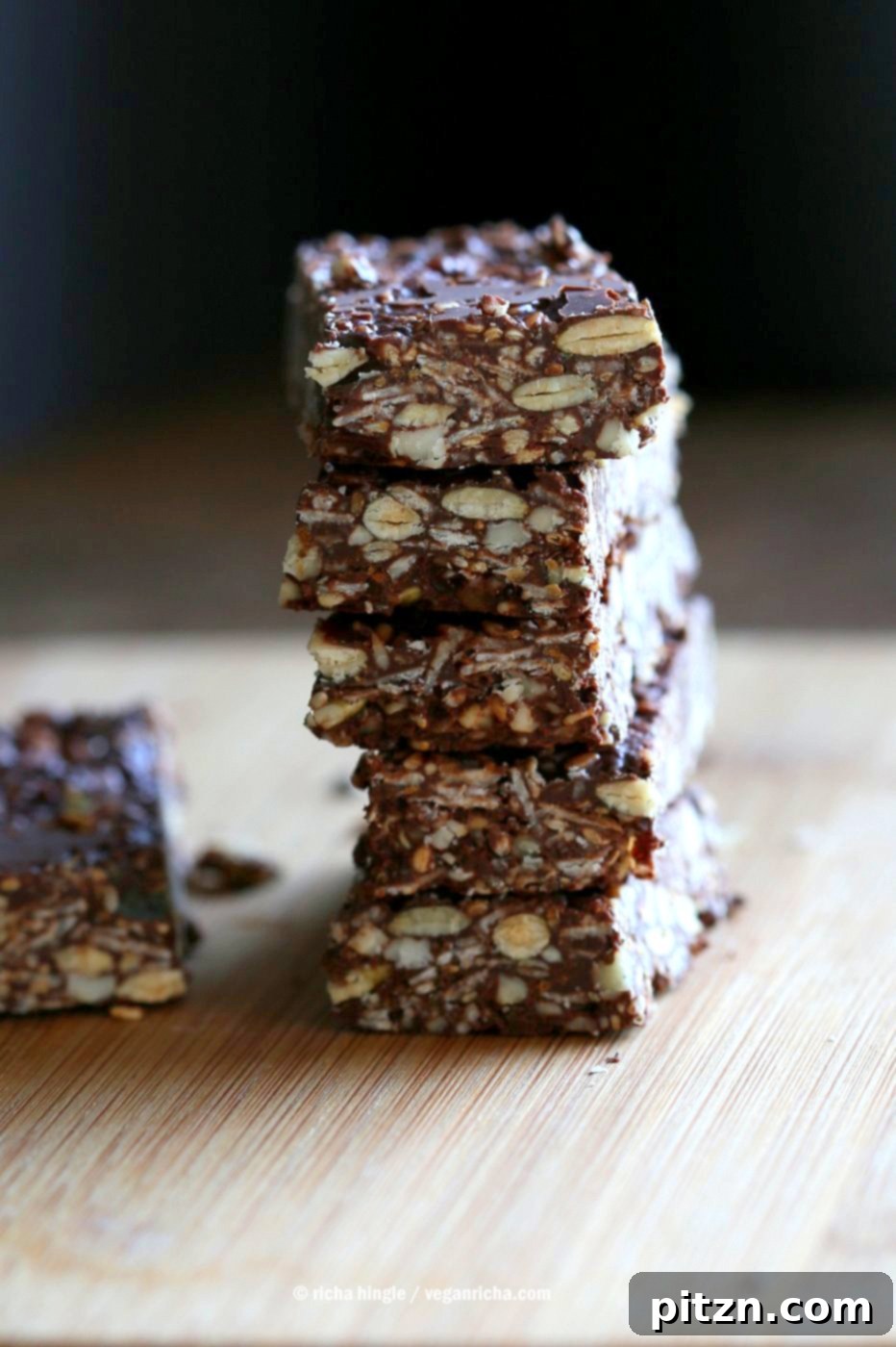 Seeded Ginger Chocolate No Bake Granola Bars 9 A final shot of Super Seedy Chocolate No Bake Granola Bars, beautifully arranged. This appealing image highlights the quality and deliciousness of these easy-to-make, healthy, vegan, and gluten-free snack bars, perfect for those seeking nut-free options and infused with candied ginger and gingerbread spices. Ideal for a healthy lifestyle.