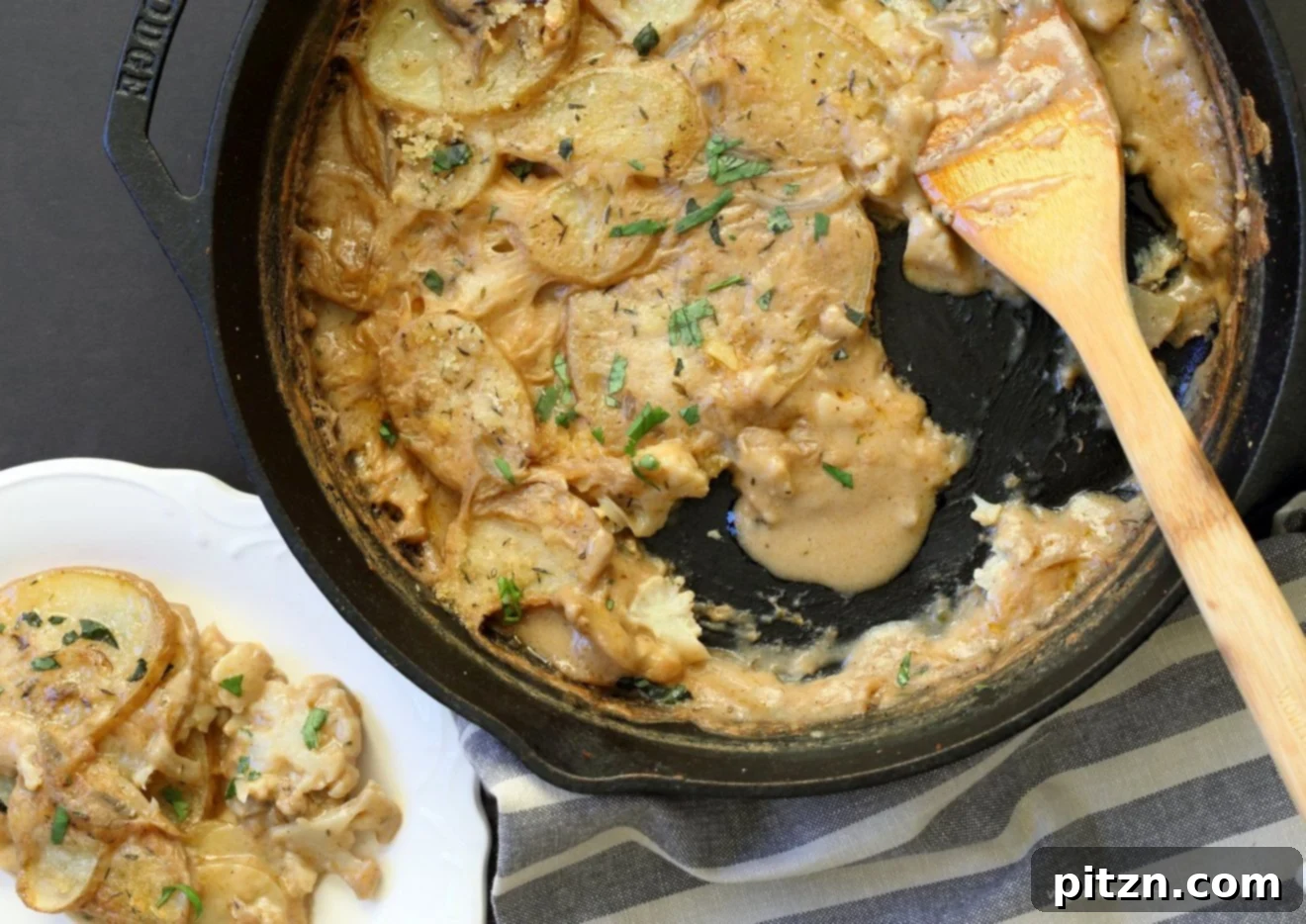 Caribbean Curry Vegan Scallop Bake 3 Close-up of baked Vegan Scalloped Potatoes and Cauliflower with a crispy breadcrumb topping, showcasing the creamy sauce and tender vegetables. #vegan #soyfree #veganricha #recipe