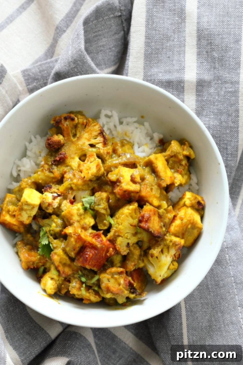 Spiced Cauliflower and Tofu in Green Masala Sauce. Baked Cauliflower and Tofu in green cilantro sauce. The sauce paste can be made ahead and stored. Vegan Gluten-free Nut-free Recipe. Can be soy-free with chickpea tofu or chickpeas or beans or other veggies. | VeganRicha.com