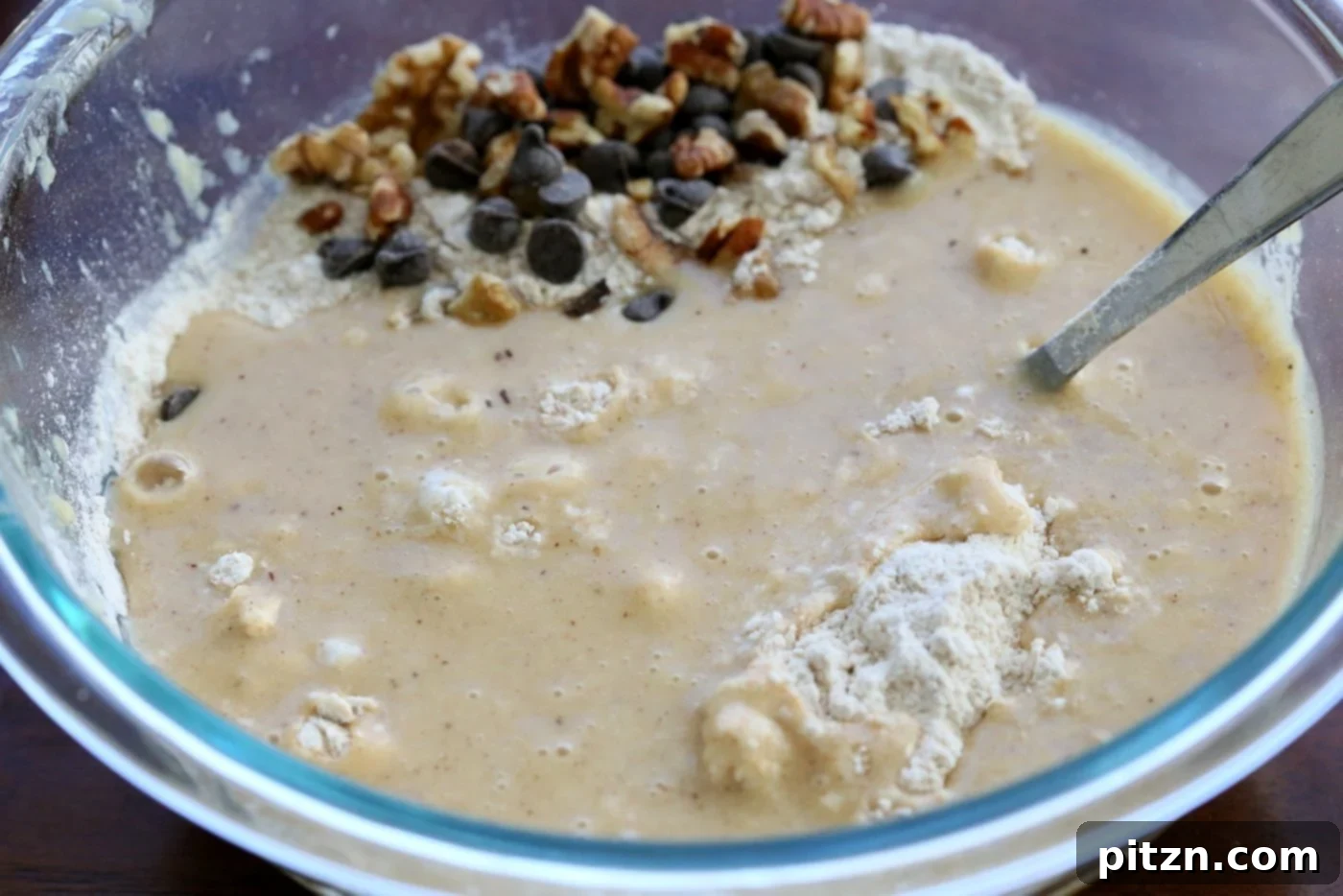 Preparing the vegan banana bread batter in a single bowl. 
