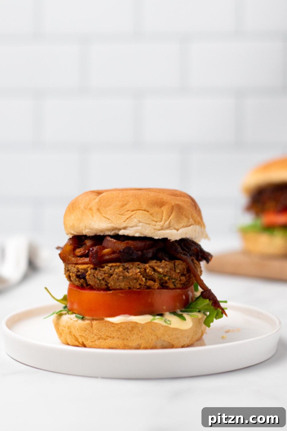 chickpea burger a vegan za'atar spiced chickpea burger on a white plate