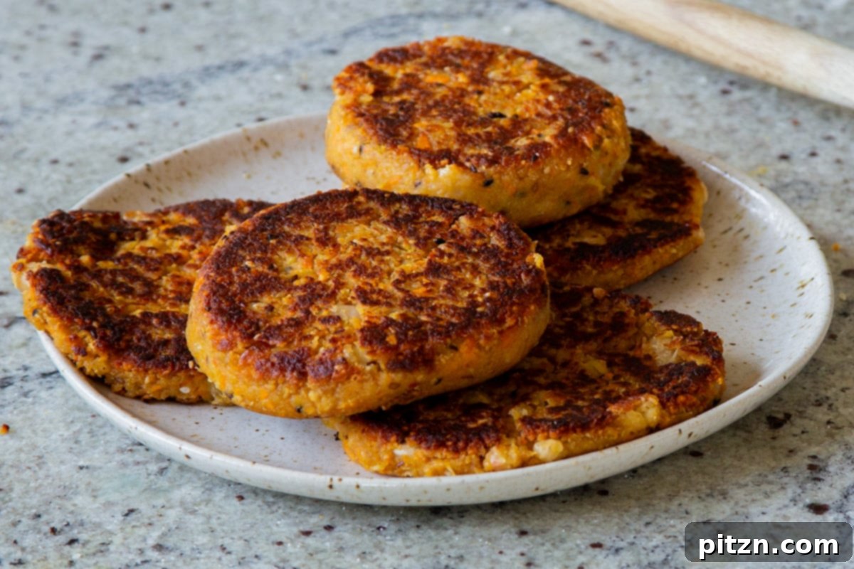 Hearty Peanut Carrot White Bean Burgers 13 Step 8: Assembling the white bean burgers with fresh toppings and a generous drizzle of sauce.