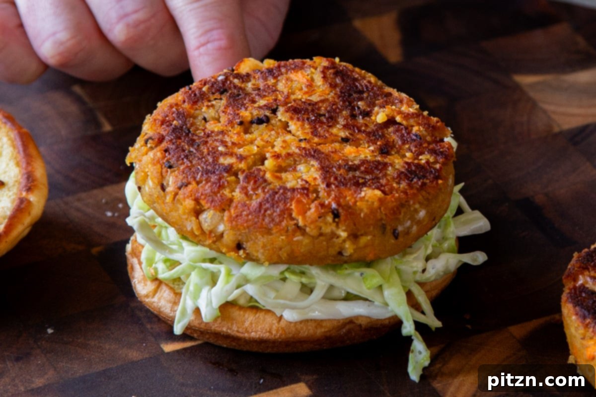 Hearty Peanut Carrot White Bean Burgers 14 Step 9: A beautifully assembled Peanut Carrot White Bean Burger, ready to be enjoyed.