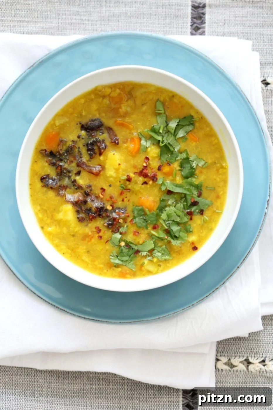 A vibrant bowl of Lentil Veggie Dhansak, a nutritious and flavorful Parsi Indian Dal and vegetable curry. Ideal for serving with rice or flatbread, prepared in an Instant Pot or Saucepan. Vegan and Gluten-free.