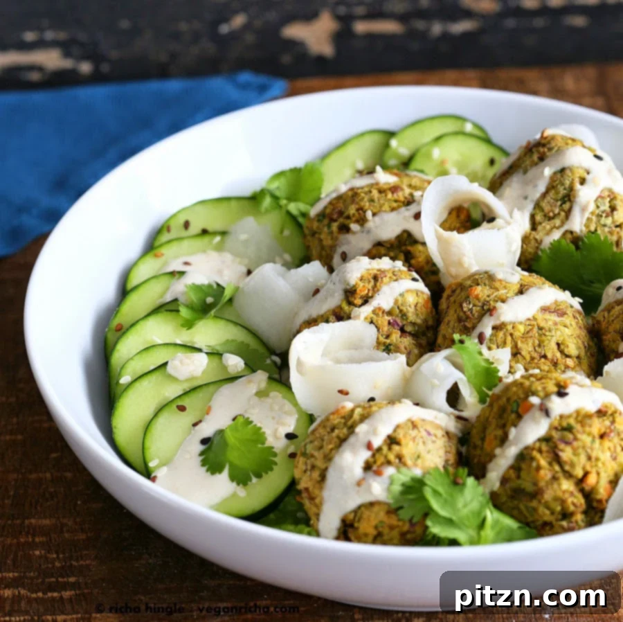 Four baked falafel balls neatly arranged, ready to be served