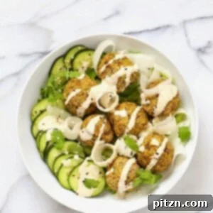 Delicious Baked Lentil Split Pea Falafels in a bowl with dressing