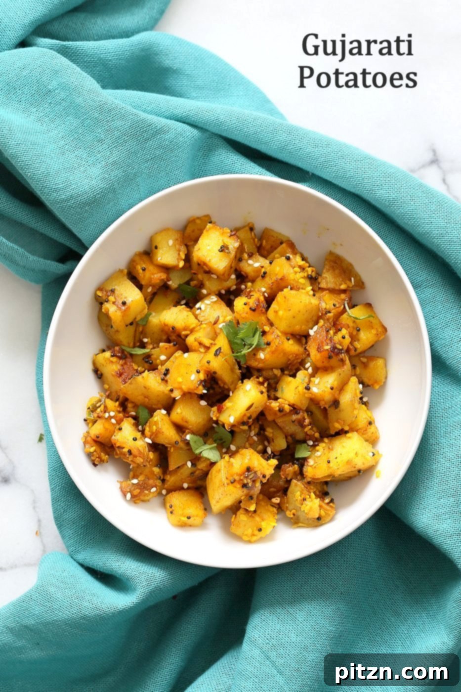 Tangy Gujarati Sesame Potatoes: Bateta Nu Shaak 2 Gujarati Potatoes with Sesame Seeds. Indian Spiced Potatoes with sesame seed and peanuts. Vegan Gluten-free Soy-free Indian Gujarati Recipe. | VeganRicha.com