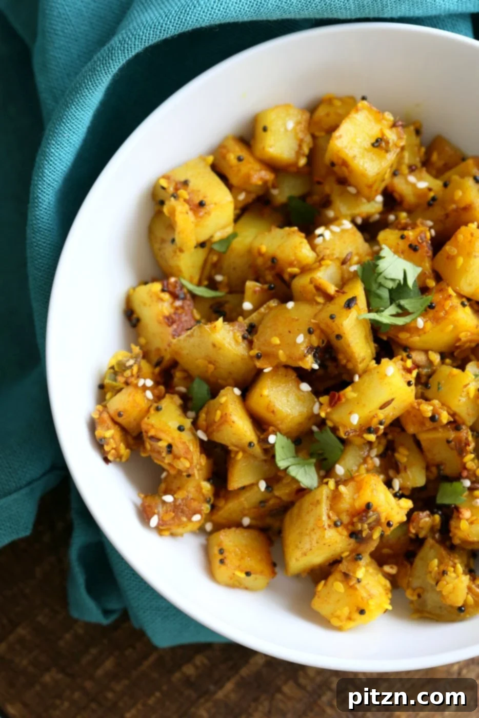 Tangy Gujarati Sesame Potatoes: Bateta Nu Shaak 3 Gujarati Potatoes with Sesame Seeds. Indian Spiced Potatoes with sesame seed and peanuts. Vegan Gluten-free Soy-free Indian Gujarati Recipe. | VeganRicha.com