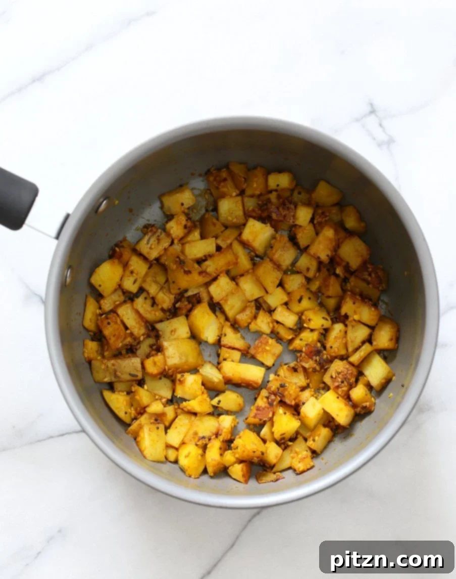 Tangy Gujarati Sesame Potatoes: Bateta Nu Shaak 4 Gujarati Potatoes with Sesame Seeds. Indian Spiced Potatoes with sesame seed and peanuts. Vegan Gluten-free Soy-free Indian Gujarati Recipe. Bateta Nu Shaak | VeganRicha.com