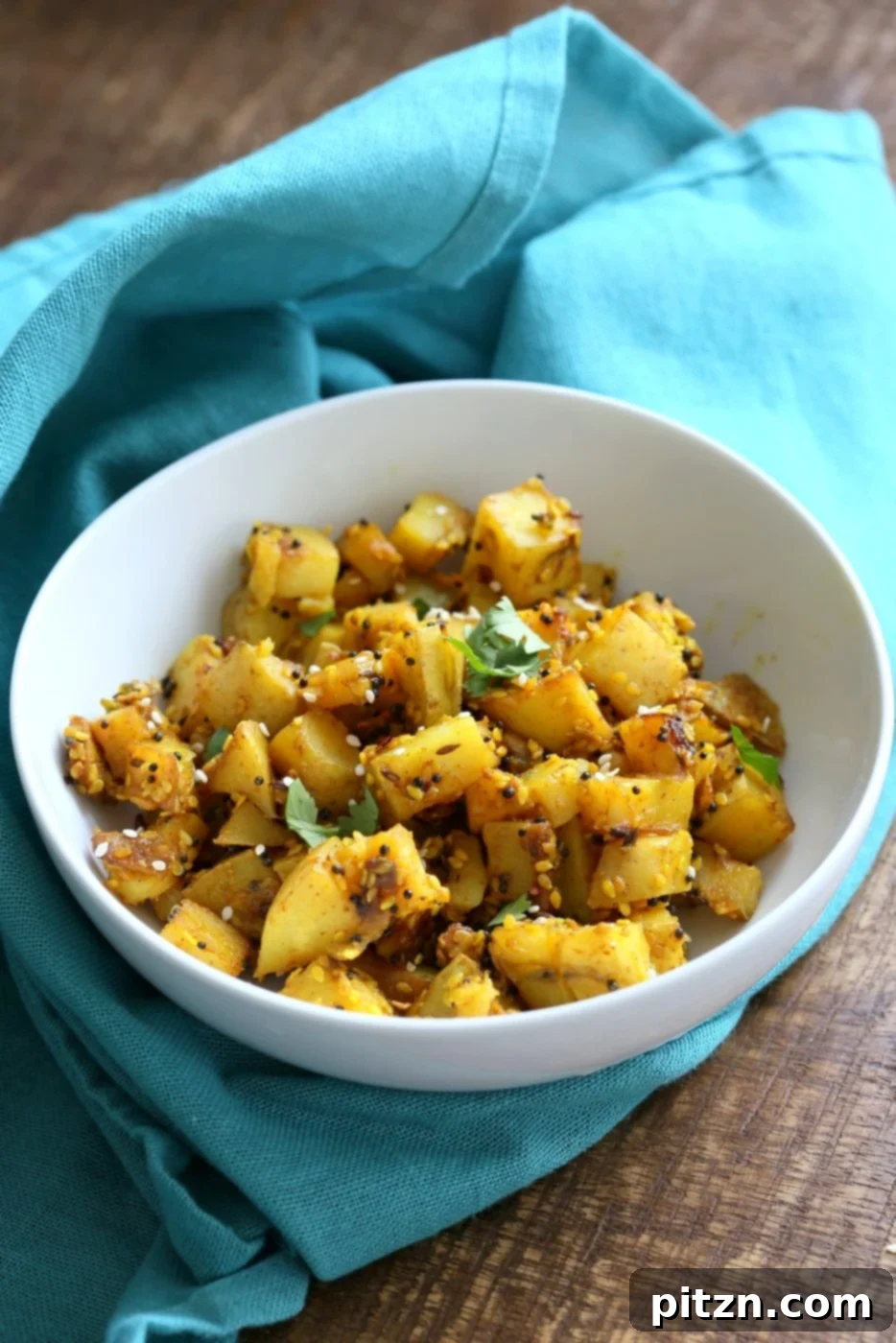 Tangy Gujarati Sesame Potatoes: Bateta Nu Shaak 7 Gujarati Potatoes with Sesame Seeds. Indian Spiced Potatoes with sesame seed and peanuts. Vegan Gluten-free Soy-free Indian Gujarati Recipe. | VeganRicha.com
