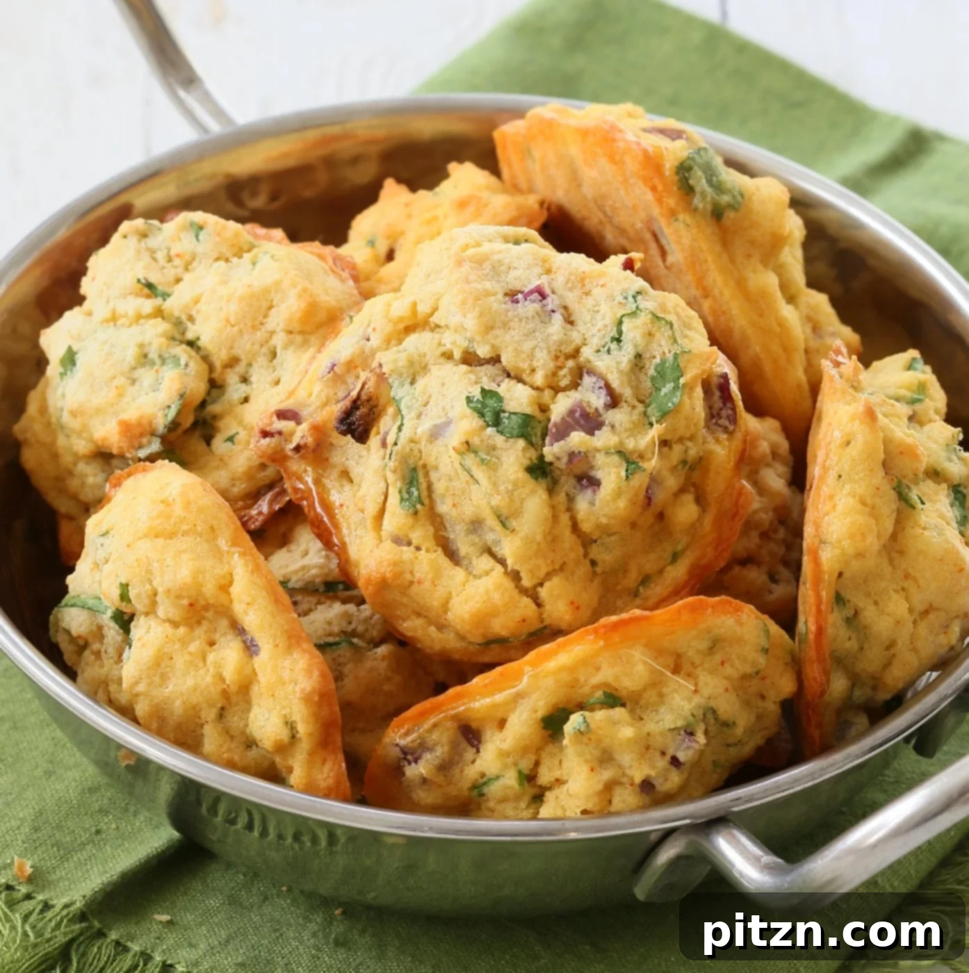 Baked Moong Dal Fritters 10 A large batch of baked Mung Dal Fritters displayed with a rustic background.