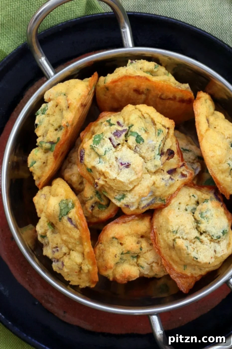 Baked Moong Dal Fritters 3 Assortment of baked Mung Dal Fritters on a serving plate.