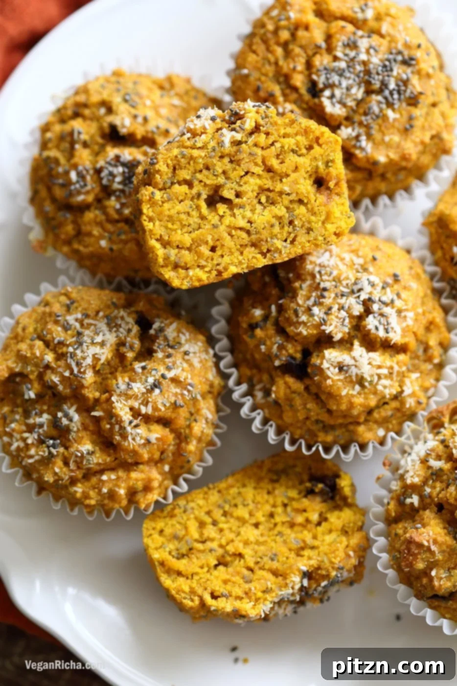 Delicious Vegan Turmeric Carrot Muffins. These golden, healthy muffins are infused with carrots, chia seeds, and coconut, and spiced with fresh ginger and turmeric for a vibrant flavor profile. A perfect no-added-sugar, no-oil, vegan, soy-free, nut-free breakfast or snack. Gluten-free friendly recipe from VeganRicha.com