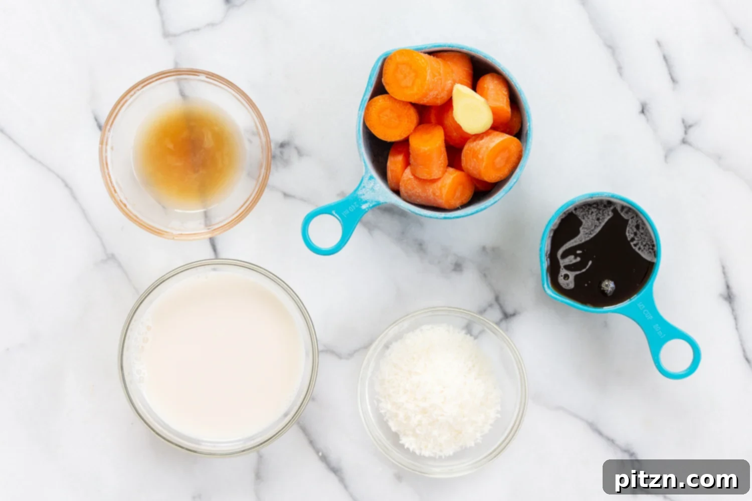 Wet Ingredients for Our Vegan Turmeric Carrot Muffins, including carrots, maple syrup, coconut, and non-dairy milk, in separate bowls before blending