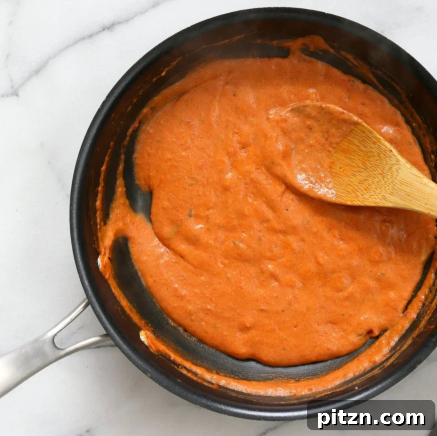 Indian Butter Sauce in black skillet for Butter Tofu Paneer