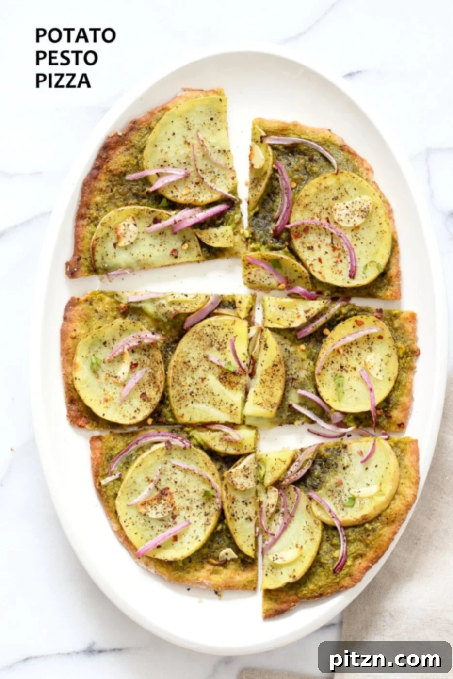 Vegan Basil Spinach Potato Pesto Pizza 2 Delicious Easy Potato Pesto Pizza with a quick 20-minute thin crust, topped with fresh basil spinach pesto, thin potato slices, onion, and garlic. Perfect vegan and soy-free meal.