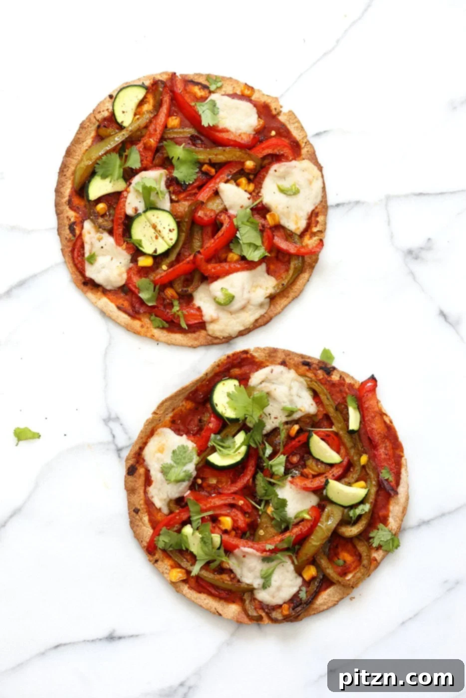 Freshly baked Vegetable Fajita Tortilla Pizza, hot from the oven, with perfectly melted vegan cheese and colorful fajita vegetables.