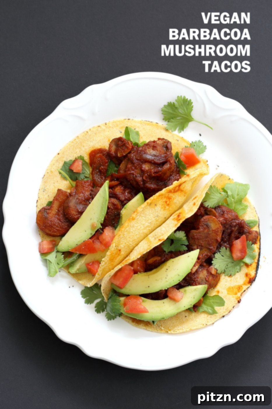 Close-up of saucy, juicy, spicy Vegan Barbacoa Mushroom Tacos