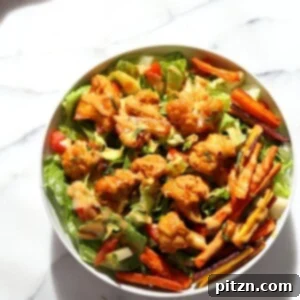 Peanut Butter Cauliflower Bowl with Roasted Carrots. Cauliflower tossed in peanut butter sauce and roasted, carrots tossed in hot sauce and roasted. Vegan Recipe, Gluten-free Recipe. | VeganRicha.com