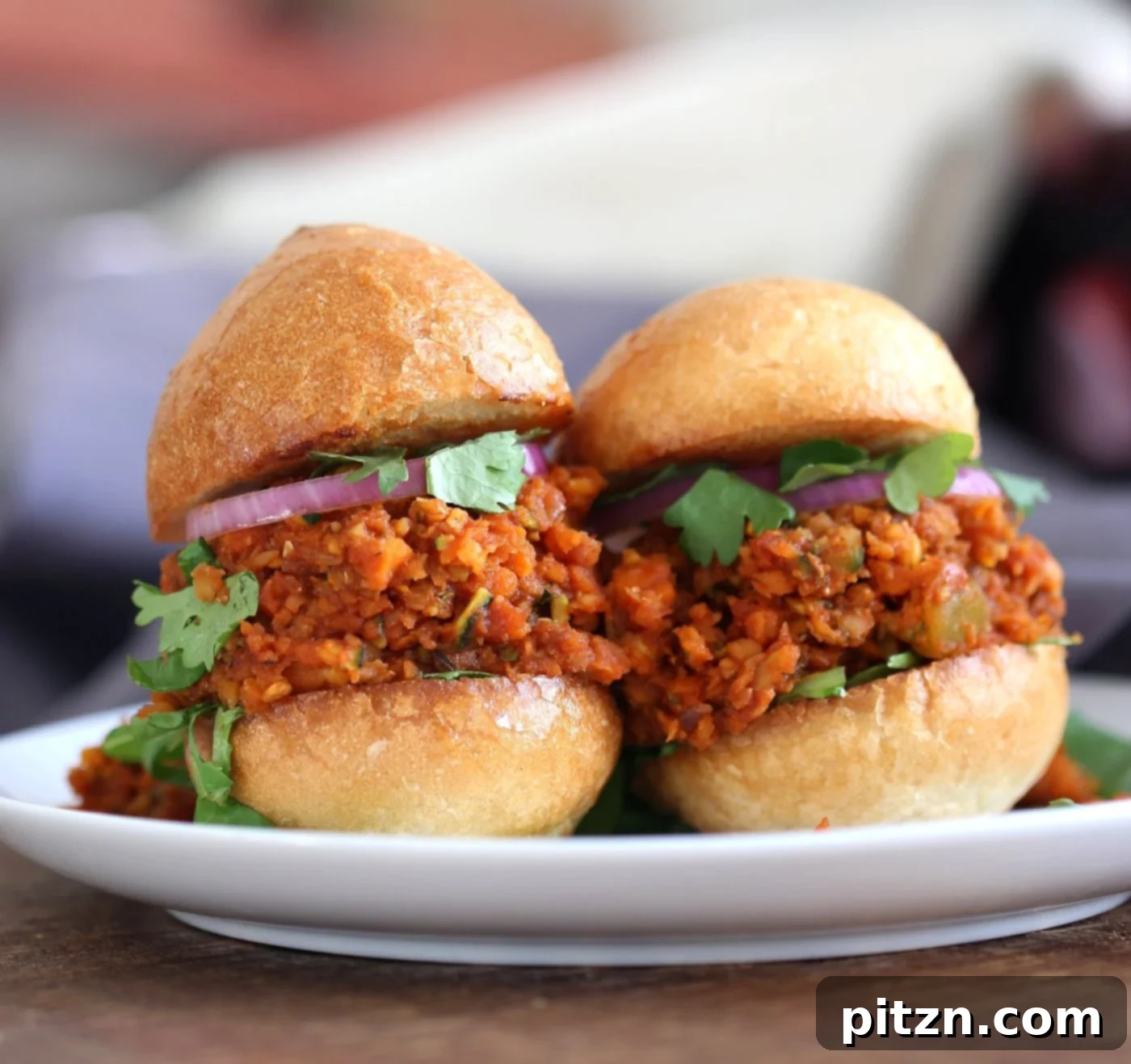 Cajun Spiced Smoky Vegan Sloppy Lentils 3 Close-up of Smoky Vegan Sloppy Joes with Cajun Spices, showcasing the rich, spiced lentil, carrot, and zucchini filling. A perfect plant-based alternative.