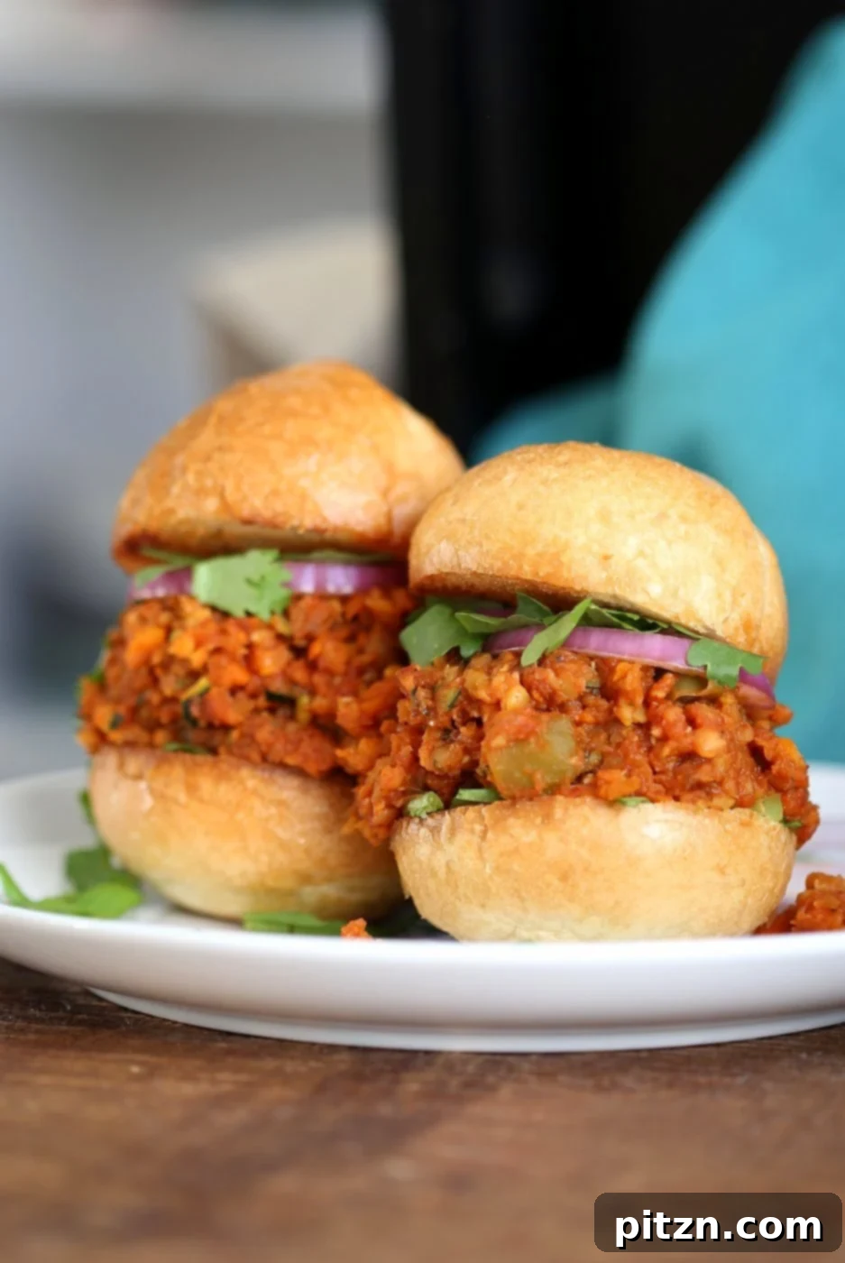 Cajun Spiced Smoky Vegan Sloppy Lentils 4 Ingredients for Smoky Vegan Sloppy Joes: cooked red lentils, shredded carrots and zucchini, and a vibrant mix of spices laid out, ready for cooking.
