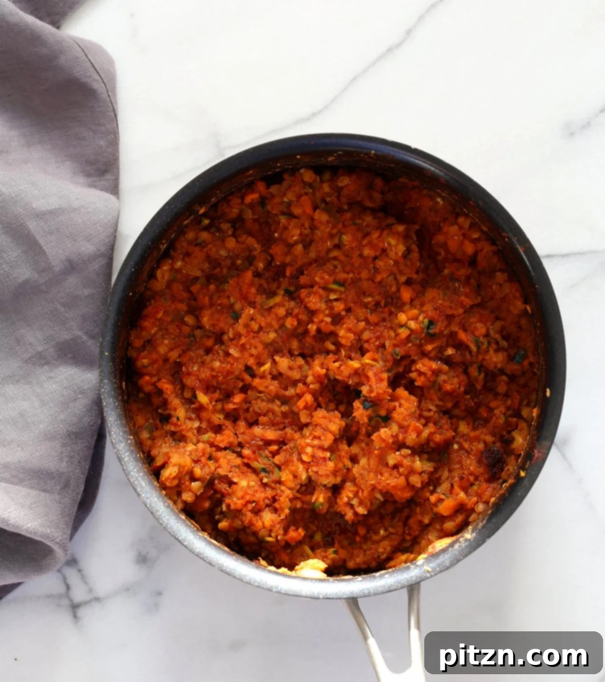 Cajun Spiced Smoky Vegan Sloppy Lentils 8 The smoky vegan sloppy joe mix simmering in a skillet, achieving the perfect thick and rich consistency.