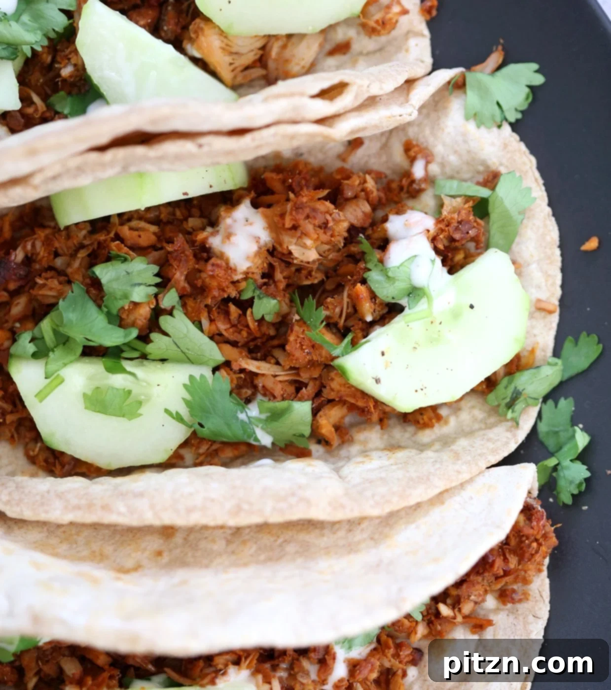 Berbere Spiced Jackfruit Tacos 3 Close-up of baked Berbere spiced jackfruit, showcasing its caramelized texture and rich color, ready to be served in tacos.