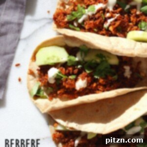Berbere Spiced Jackfruit Tacos. Jackfruit and onion mixed with Berbere spice blend and baked to caramelized perfection. Add some chickpeas to make into a hearty meal. Vegan Soy-free Nut-free Recipe, Can be Glutenfree | VeganRicha.com
