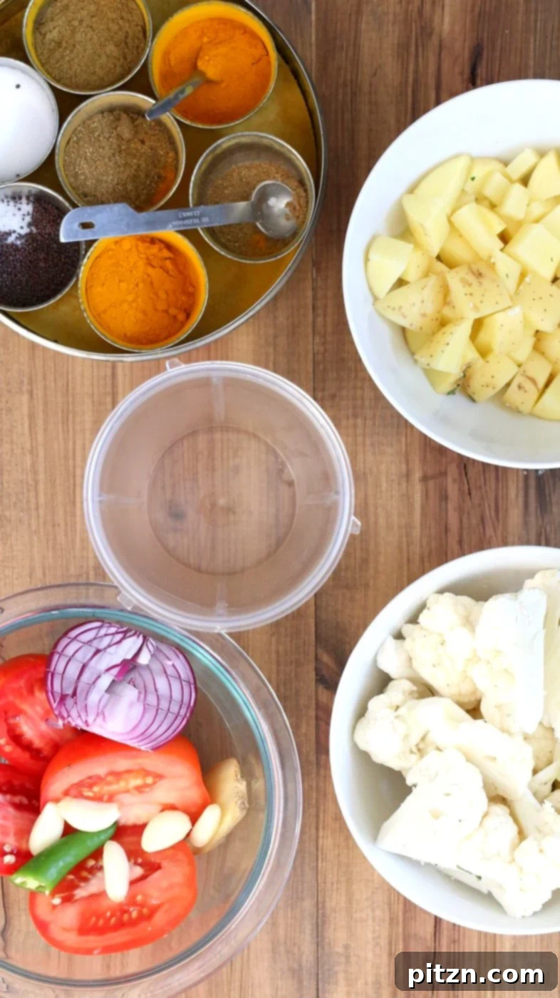 Instant Pot Aloo Gobi - Curried Potato Cauliflower. A close-up of the delicious and healthy Indian curry, ready to be served. Vegan, Gluten-free, Soy-free, Nut-free recipe.