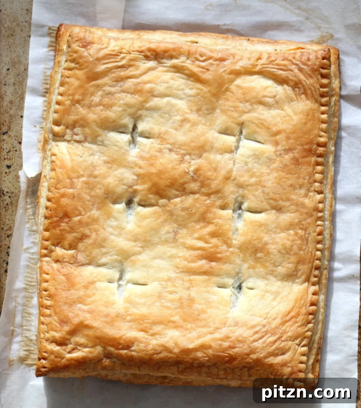 A close-up of a slice of Chickpea Spinach Pie, showing the savory filling.