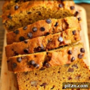One-bowl vegan pumpkin bread, a moist loaf filled with pumpkin puree, spices, walnuts, and chocolate chips.
