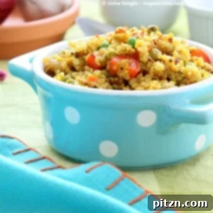 Nutritious South Indian Quinoa Salad in a blue polka dot dish, featuring pumpkin, tamarind, peppers, and peas.